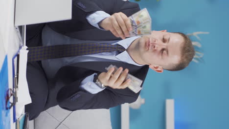 Vertical-video-of-Home-office-worker-man-counting-money-funny-and-funny.